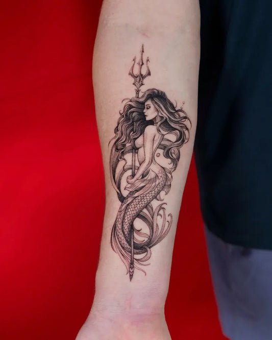 Medium Black and Grey Mermaid with Trident Tattoo on Men Arm by @dragoncityink.danang