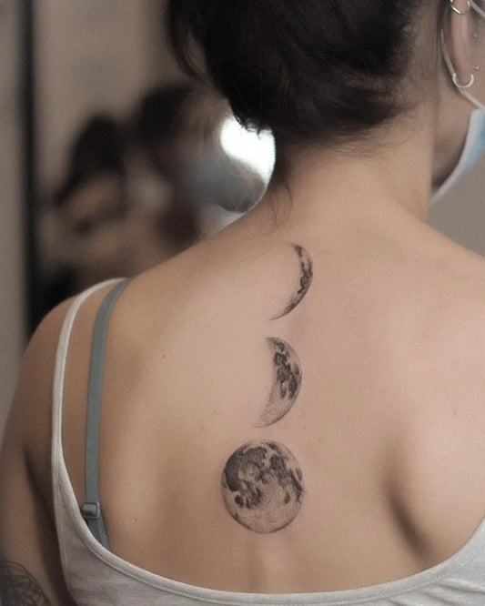 Medium Black and Grey Moon Phases Tattoo on Women Back by @giada.tattooing