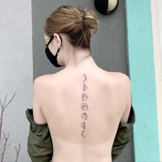 Medium Black and Grey Moon Phases Tattoo on Women Back by @shadow_tattooer