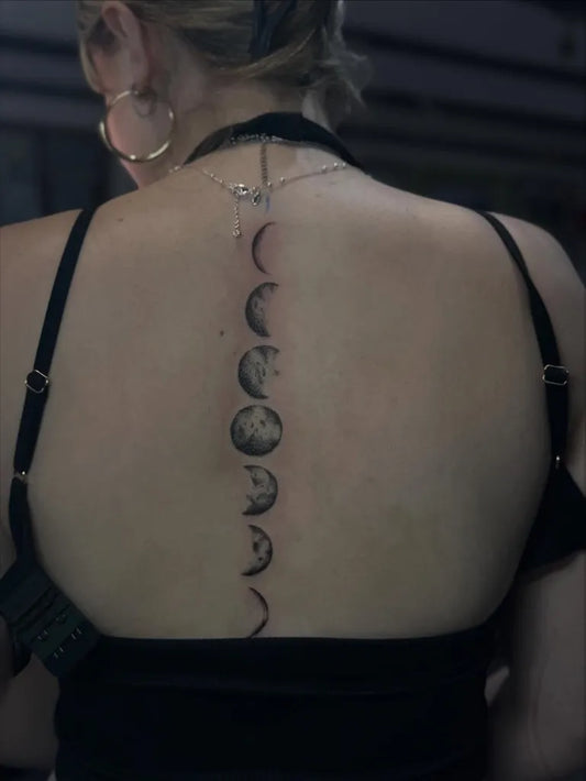 Medium Black and Grey Moon Phases Tattoo on Women Spine by @alexmtattoos