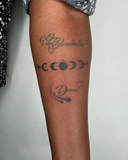 Medium Black and Grey Moon Phases and Script Tattoo on Women Arm by @francielitattooart