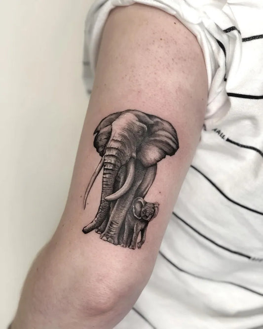 Medium Black and Grey Mother Elephant and Calf Tattoo on Women Arm by @aliceink_tattoos