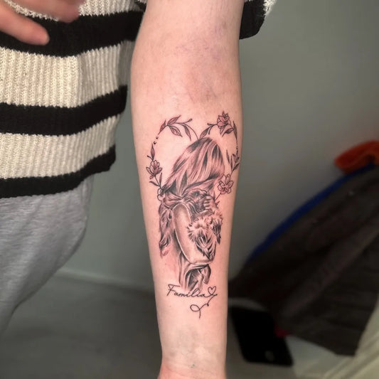 Medium Black and Grey Mother and Child Family Tattoo on Women Arm by @inkyvibestattoo