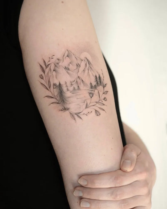 Medium Black and Grey Mountain Lake Forest Tattoo on Women Arm by @stechzart