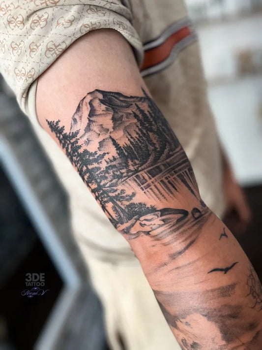 Medium Black and Grey Mountain Lake Trees Tattoo on Men Arm by @noemivart