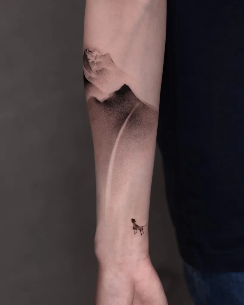 Medium Black and Grey Mountain and Dog Tattoo on Men Arm by @newtattoo_studio
