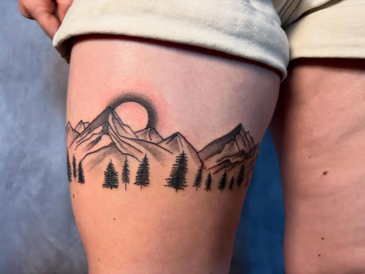 Medium Black and Grey Mountain and Trees Tattoo on Women Thigh by @5thstreetinktattoo