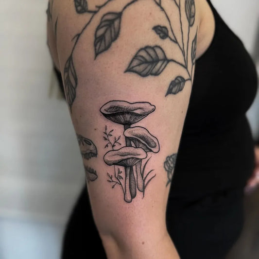 Medium Black and Grey Mushrooms and Leaves on Women Arm Tattoo by @littleferntattoo