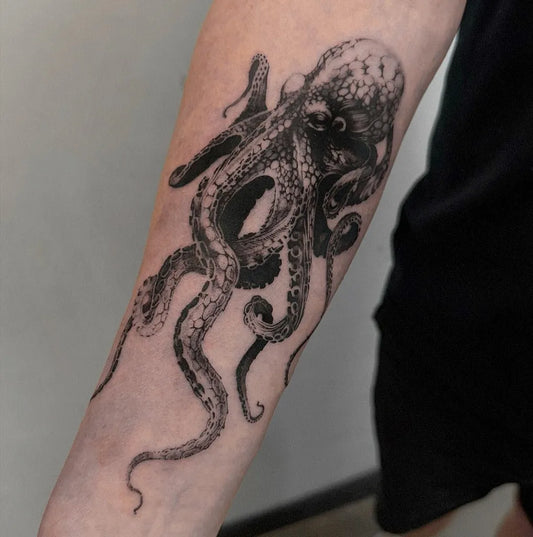 Medium Black and Grey Octopus Tattoo on Men Arm by @ricktattoo