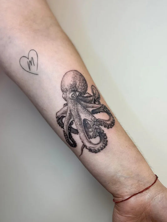 Medium Black and Grey Octopus Tattoo on Women Arm by @delamartattoo