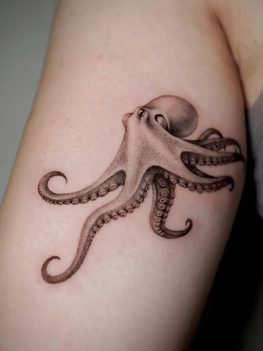 Medium Black and Grey Octopus Tattoo on Women Arm by @laurea.ink