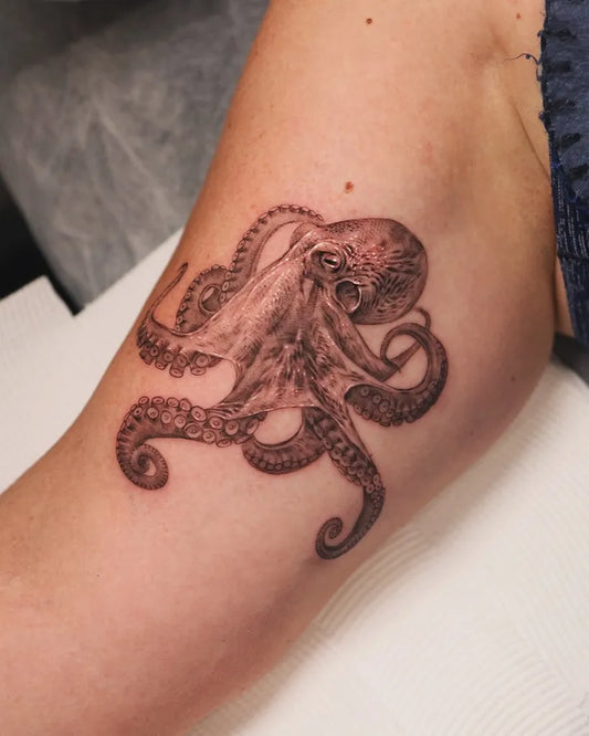 Medium Black and Grey Octopus Tattoo on Women Arm by @yonder.tattoo