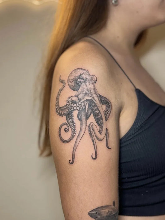 Medium Black and Grey Octopus Tattoo on Women Shoulder by @delamartattoo