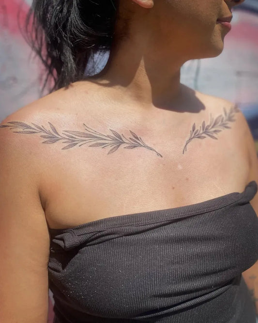 Medium Black and Grey Olive Branches Tattoo on Women Collarbone by @alyxtheartist