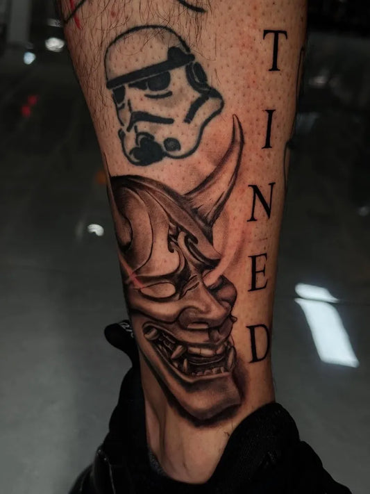 Medium Black and Grey Oni Mask Stormtrooper on Men Leg Tattoo by @tattoosbymcg