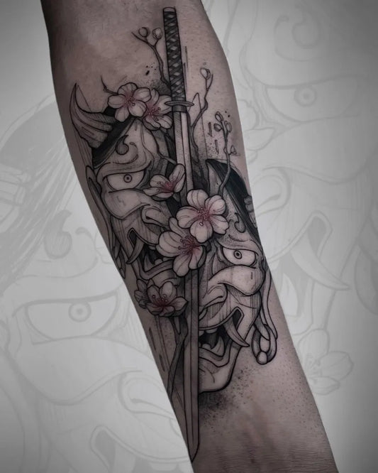 Medium Black and Grey Oni Mask with Cherry Blossoms and Sword on Men Arm Tattoo by @mairy_bubble_tattoo