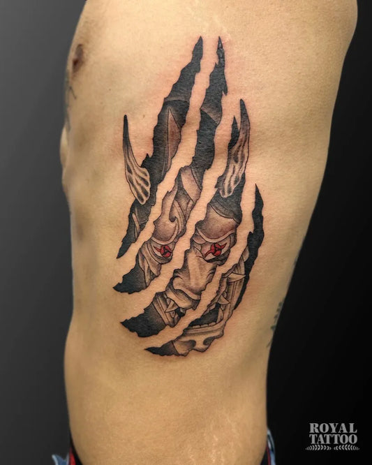 Medium Black and Grey Oni Mask with Claw Tears on Men Rib Tattoo by @royaltattooyyc