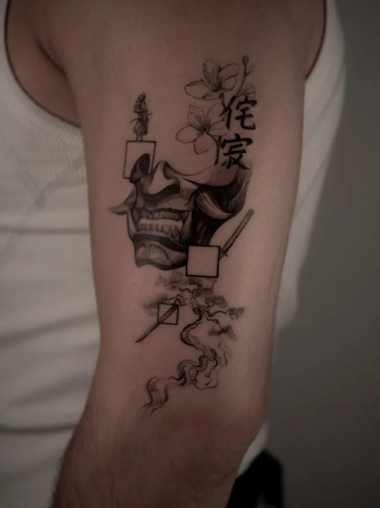Medium Black and Grey Oni Mask with Plum Blossoms and Kanji on Men Arm Tattoo by @onur.kolev