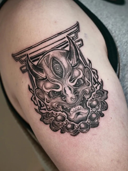 Medium Black and Grey Oni Mask with Torii Gate on Men Arm Tattoo by @timbo.tattoo