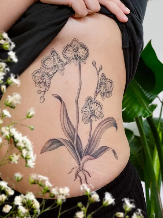 Medium Black and Grey Orchid Flowers Tattoo on Women Rib by @loudplanetstattoo