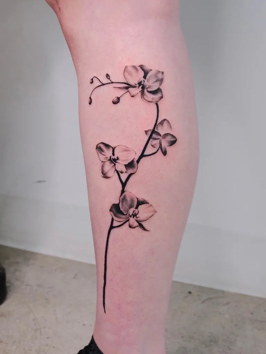 Medium Black and Grey Orchid Tattoo on Women Leg by @local_p0ke