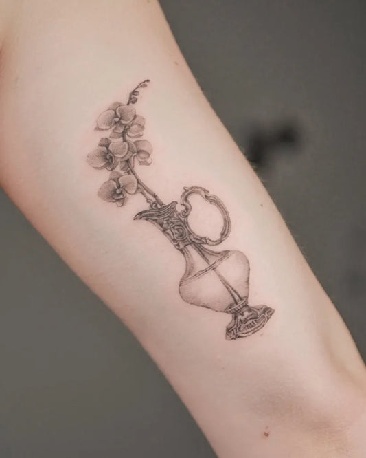 Medium Black and Grey Orchid Vase Tattoo on Women Arm by @martina.ferrario.tattoo
