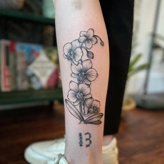 Medium Black and Grey Orchid and Kanji Tattoo on Women Leg by @greatoaktattoo