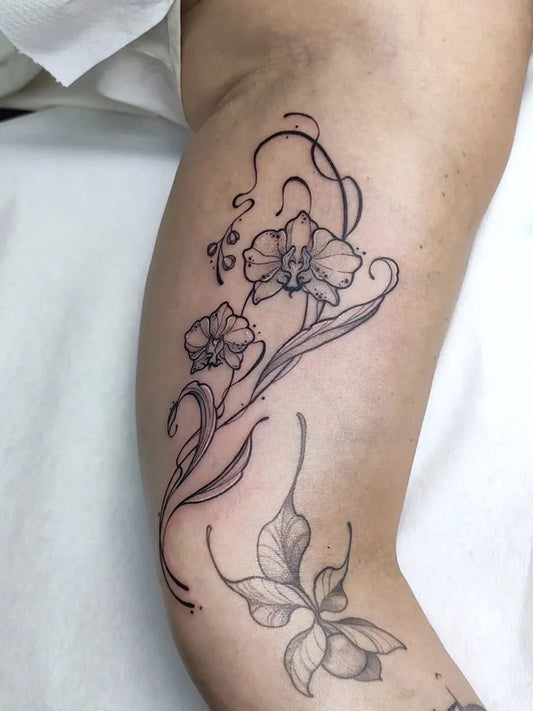 Medium Black and Grey Orchid and Leaves Tattoo on Women Arm by @mape_tattoo