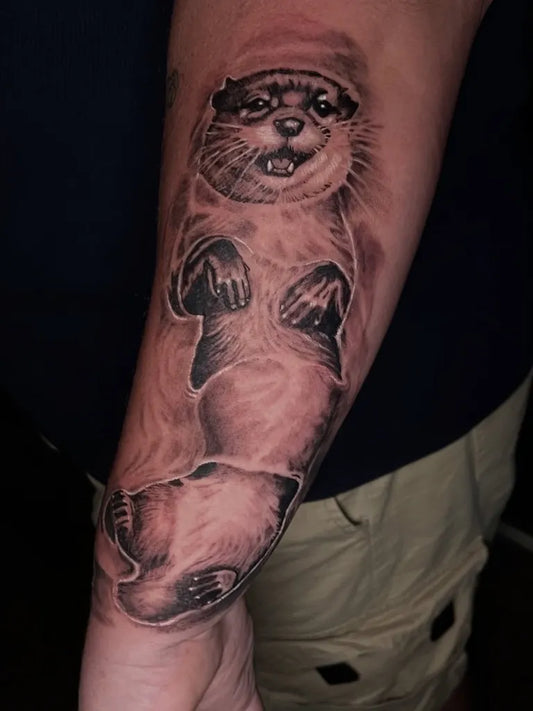 Medium Black and Grey Otter Animal Tattoo on Men Arm by @rexmancita_art
