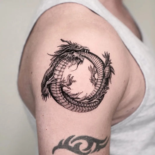 Medium Black and Grey Ouroboros Dragon Tattoo on Men Shoulder by @mammon_black