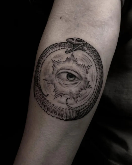 Medium Black and Grey Ouroboros Eye Tattoo on Women Arm by @registattooer