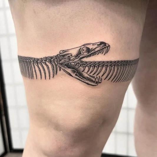 Medium Black and Grey Ouroboros Skeleton Snake Tattoo on Women Thigh Wrap by @hollihorrortattoos