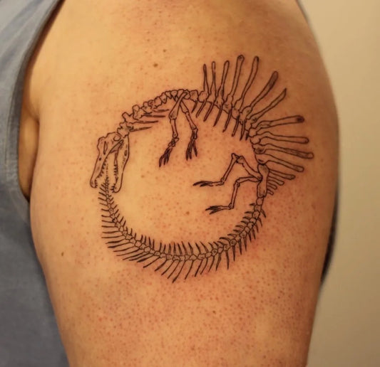 Medium Black and Grey Ouroboros Skeleton Tattoo on Men Arm by @amandaktattoos