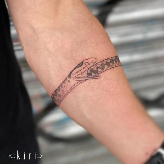 Medium Black and Grey Ouroboros Tattoo on Men Arm by @kiri.vrs