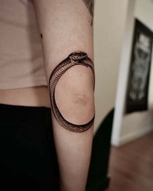 Medium Black and Grey Ouroboros Tattoo on Women Arm by @minu_tattooer