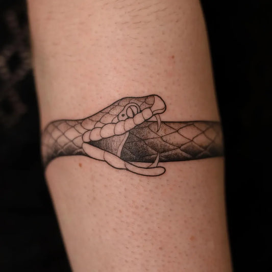 Medium Black and Grey Ouroboros Tattoo on Women Arm by @robertgoudappel