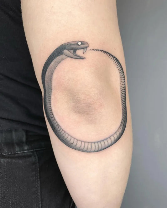 Medium Black and Grey Ouroboros Tattoo on Women Arm by @sorrymyhandsarecold