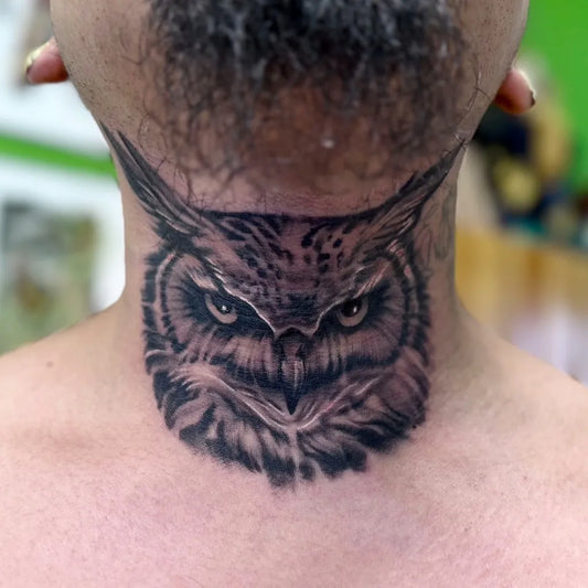 Medium Black and Grey Owl Tattoo on Men Throat by @shanghaitattoo916