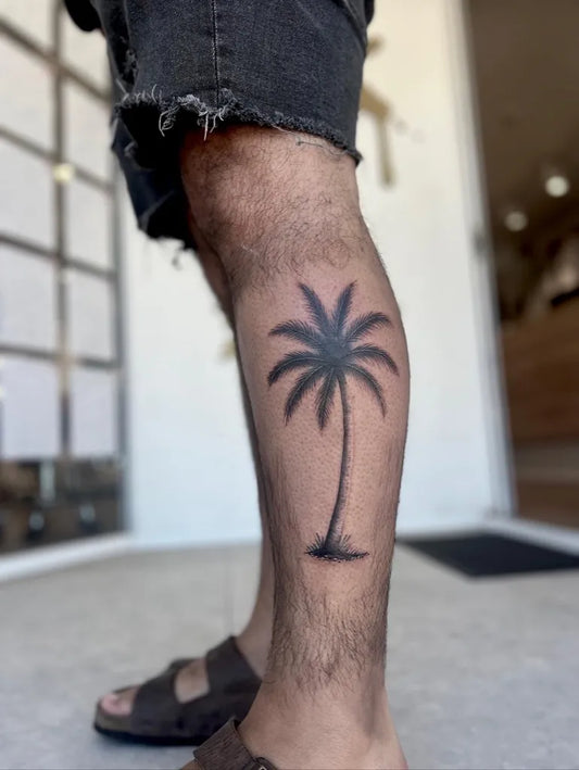 Medium Black and Grey Palm Tree Tattoo on Men Leg by @d.lawlesstattoo