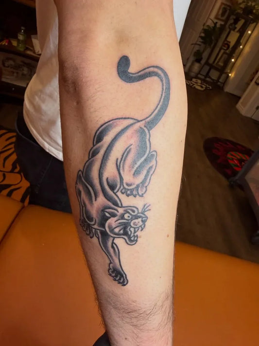 Medium Black and Grey Panther Tattoo on Men Arm by @ol55collective