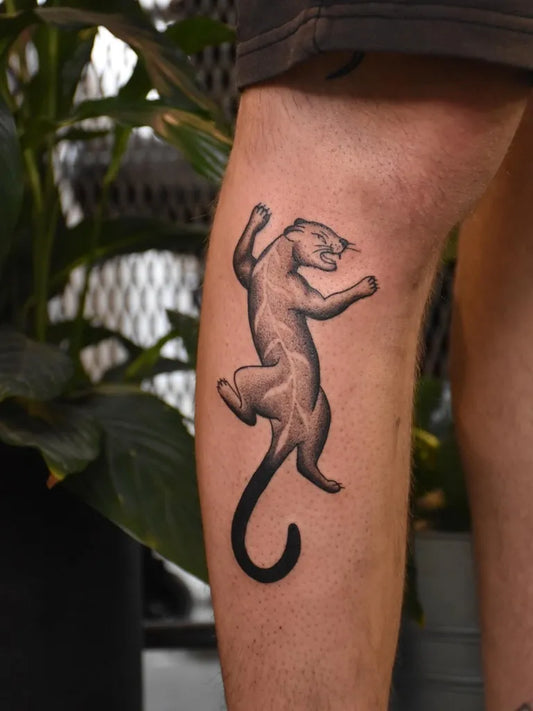 Medium Black and Grey Panther Tattoo on Men Leg by @jane13tattoo