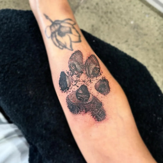 Medium Black and Grey Paw Print and Lotus Tattoo on Women Arm by @barbella.s