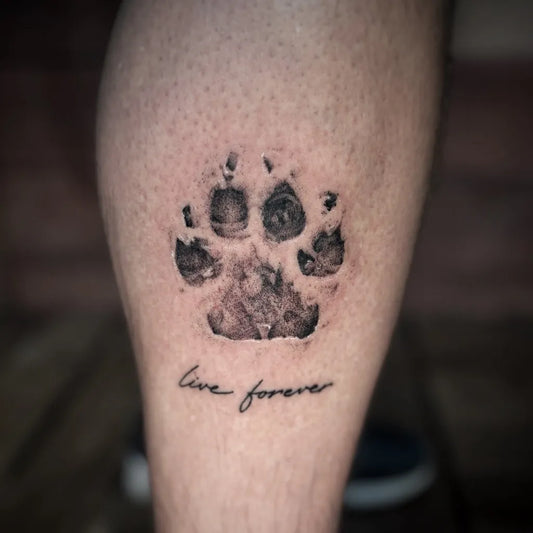 Medium Black and Grey Paw Print and Text Tattoo on Men Leg by @inky_ali