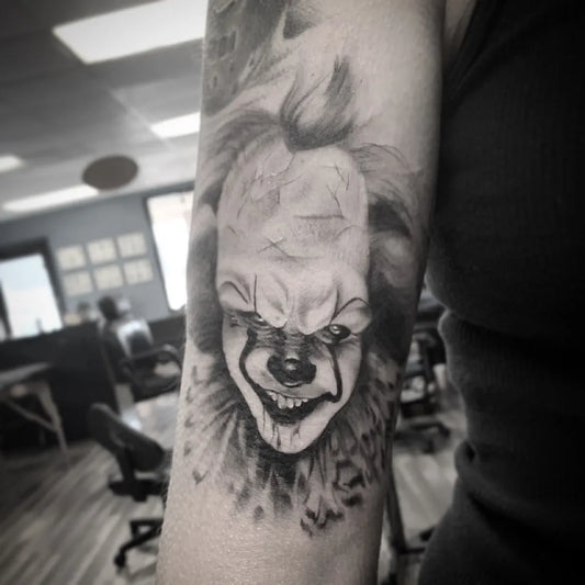 Medium Black and Grey Pennywise Clown Horror Tattoo on Women Arm by @babsie_tatts