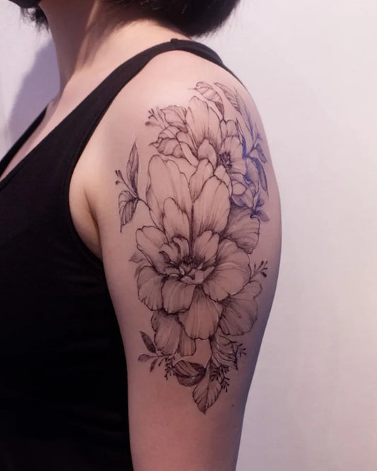 Medium Black and Grey Peonies and Leaves Tattoo on Women Upper Arm by @jynk_ink