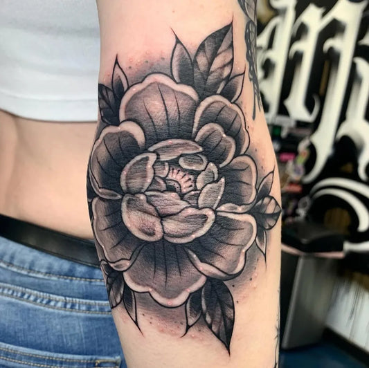 Medium Black and Grey Peony Flower Tattoo on Women Elbow by @stacia6ixxtattoos