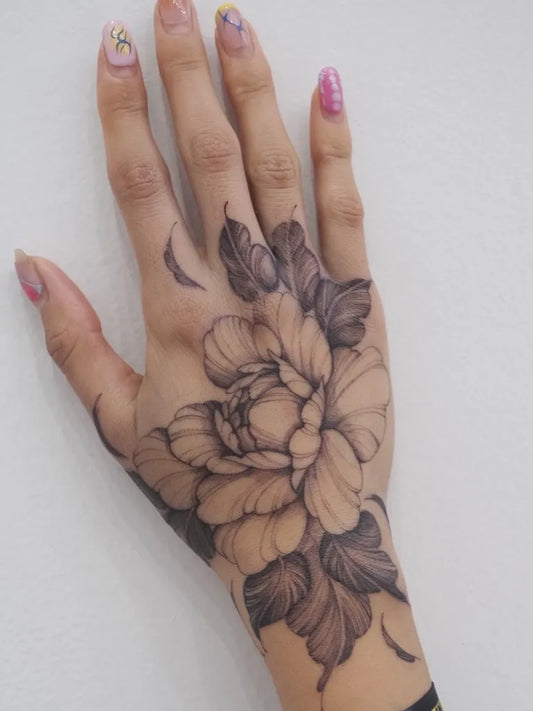 Medium Black and Grey Peony Flower on Women Hand Tattoo by @marisatattooartist