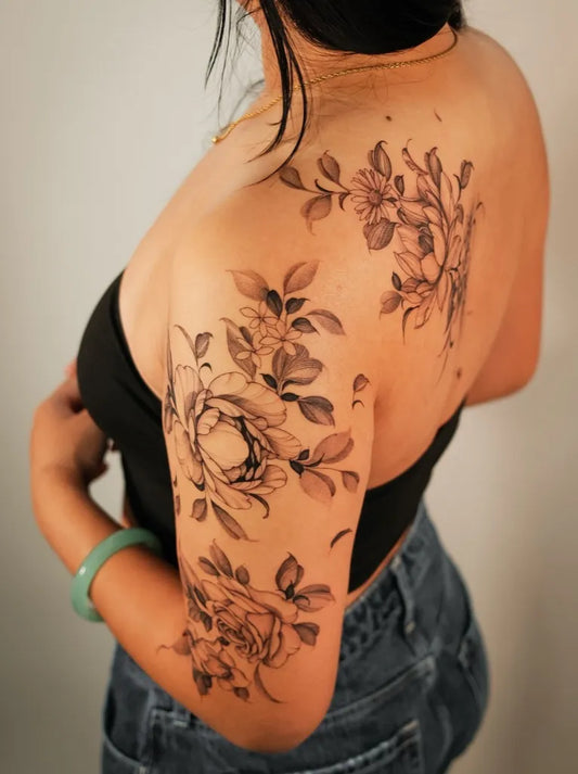 Medium Black and Grey Peony Flowers and Leaves on Women Back Tattoo by @lorietattoos