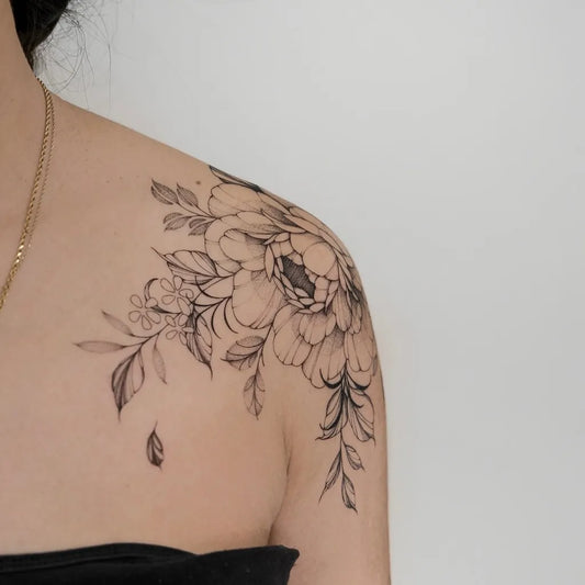 Medium Black and Grey Peony and Leaves Tattoo on Women Shoulder by @kensho.ink