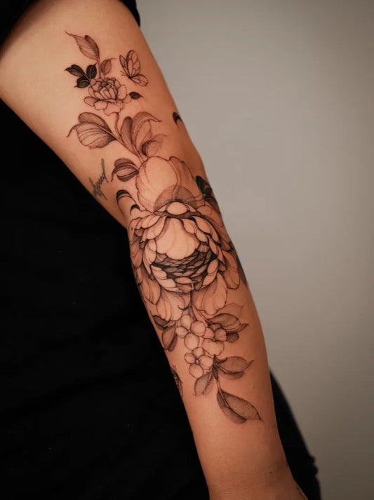 Medium Black and Grey Peony and Leaves on Women Arm Tattoo by @lorietattoos